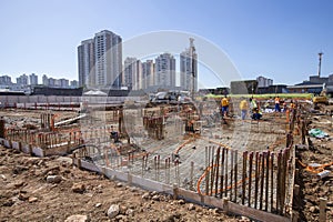 Construction workers during installation of steel gratings for the foundation of a building. Sao Paulo, Brazil