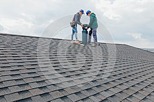 Construction workers Installing chimney and building construction concept