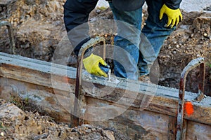 Construction workers leveling concrete pavement