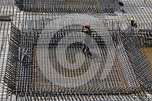 Construction workers making reinforced concrete frame
