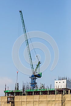 Construction workers man lifting heavy reinforcement bar in the