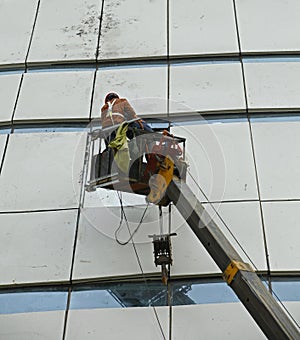Construction workers in mobile hydraulic construction platform