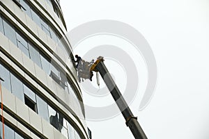 Construction workers in mobile hydraulic construction platform
