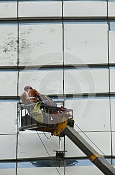 Construction workers in mobile hydraulic construction platform