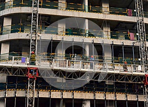 Construction workers in mobile hydraulic construction platform.