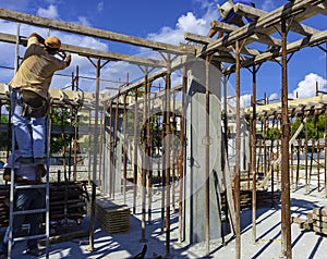 Construction workers perform the wooden formwork