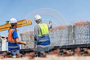 Construction Workers Planning Infrastructure Development, Engineers Team Discussing Project Progress at Construction Site, Multi-