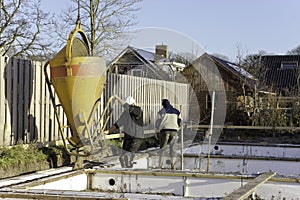 Construction workers pouring