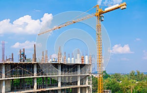 Construction workers site and building of housing at laborer work outdoor which has tower crane blue sky background with copy sp
