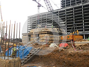 Construction workers stacking the maintain load test block at the construction site.