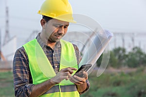 Construction workers using smartphone