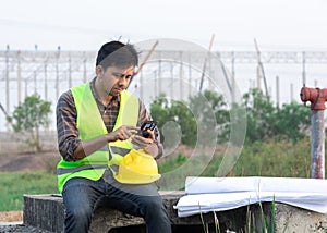 Construction workers using smartphone