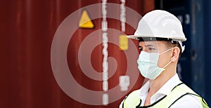 Construction workers wear safety helmet And the mask in the factory Or container. Prevent accidents at work or dust, secretion