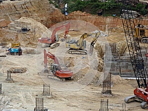 Construction workers welding pipes at the construction site.