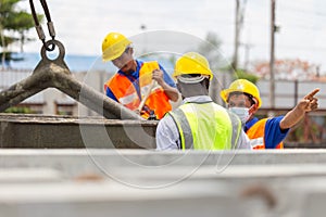 Construction workers at work, Foreman and worker team discussing at precast concrete factory site