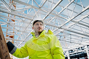 Construction workers at work on modern building site.