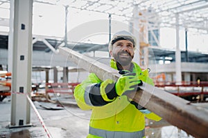 Construction workers at work on modern building site.