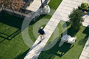 Construction workers work on roof of building