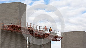 Construction Workers Working On Masonry