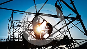 construction workers working on scaffolding