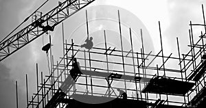 construction workers working on scaffolding