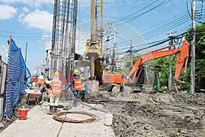 Construction workers working in site bridge piling