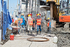 Construction workers working in site bridge piling photo