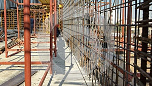 Construction workers working on steel rods used to reinforce concrete timelapse