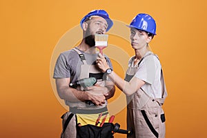 Construction workers yawning and being sleepy in studio