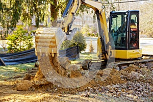 Construction works excavator moving earth