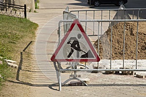Construction works sign. Repair of the road on the city street