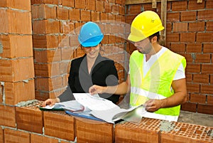 Constructions workers looking on house plans