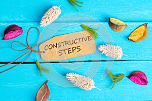 Constructive steps text on paper tag