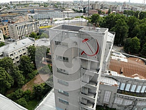 Constructivism building red hammer and sickle monument. USSR symbols. Narvskaya