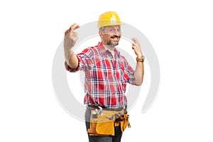 Constructor with fingers crossed as good luck concept