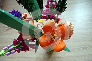 A constructor made of small parts. Plastic flowers