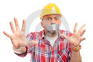 Constructor making stay away gesture with hands