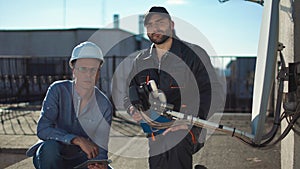 Constructor and taskmaster looking at camera