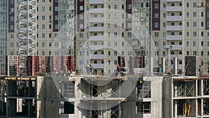 Constructors working at construction site residential building work with steel