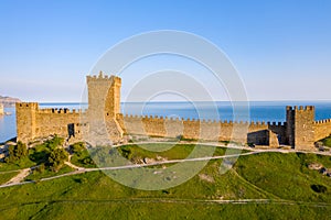 Consul Castle of the Genoese Fortress in Sudak, Crimea at sunset. Aerial shot photo