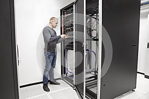 IT consultant building network rack in datacenter