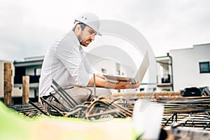 Consultant, civil engineer supervising construction works