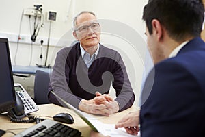 Consultant Discussing Test Results With Patient