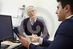 Consultant Discussing Test Results With Patient