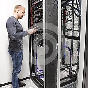 IT consultant install data racks in datacenter