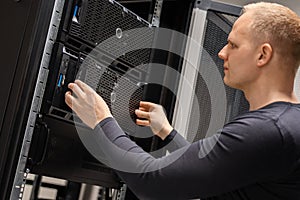 IT Consultant Installing Servers In Large Cloud Datacenter