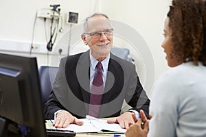 Consultant Meeting With Patient In Office