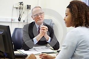 Consultant Meeting With Patient In Office