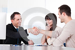 Consultant shaking hands with a man