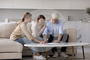 Consultant visiting senior couple at home, explaining agreement